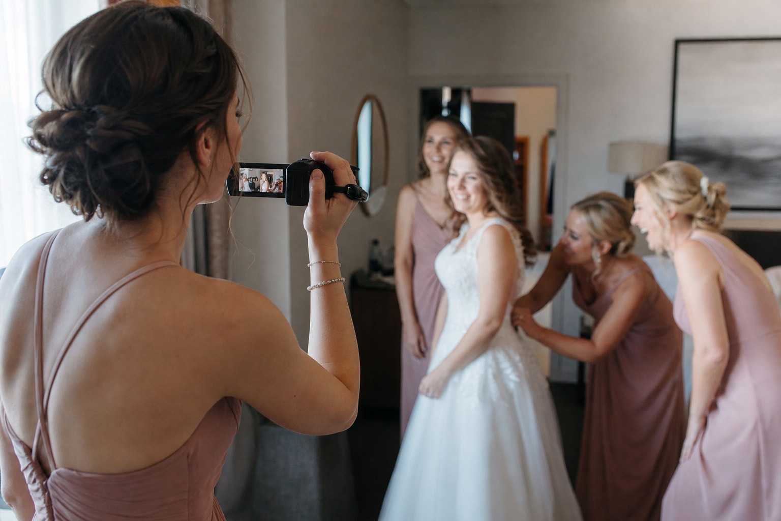 Illustrative: guest filming with a Panasonic camcorder